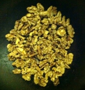 Toasting walnuts in a pan