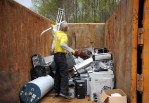 A BumbleJunk employee adds to the collection of recyclable metals collected on Clear Your Clutter Day 2015.