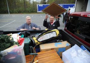 Nancy Krajewski, left, and her husband Steve begin to unload their pick-up truck full of stuff as they arrive at Clear Your Clutter Day Saturday at Harford Community College.